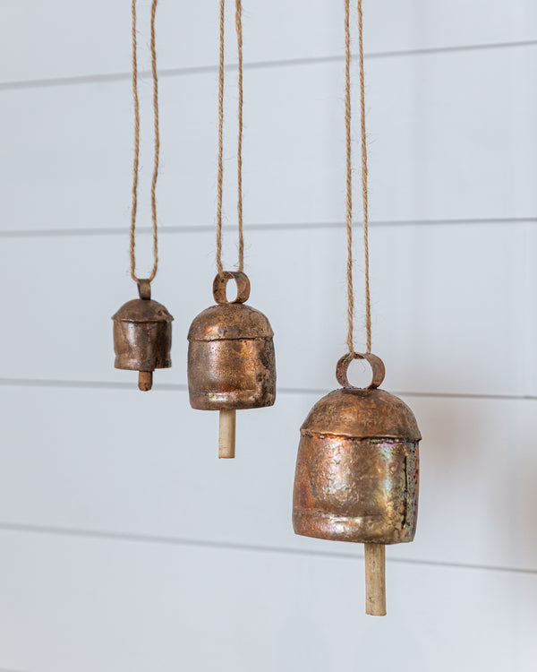 Handcrafted copper vintage bells hanging with natural rope, rustic home decor accent