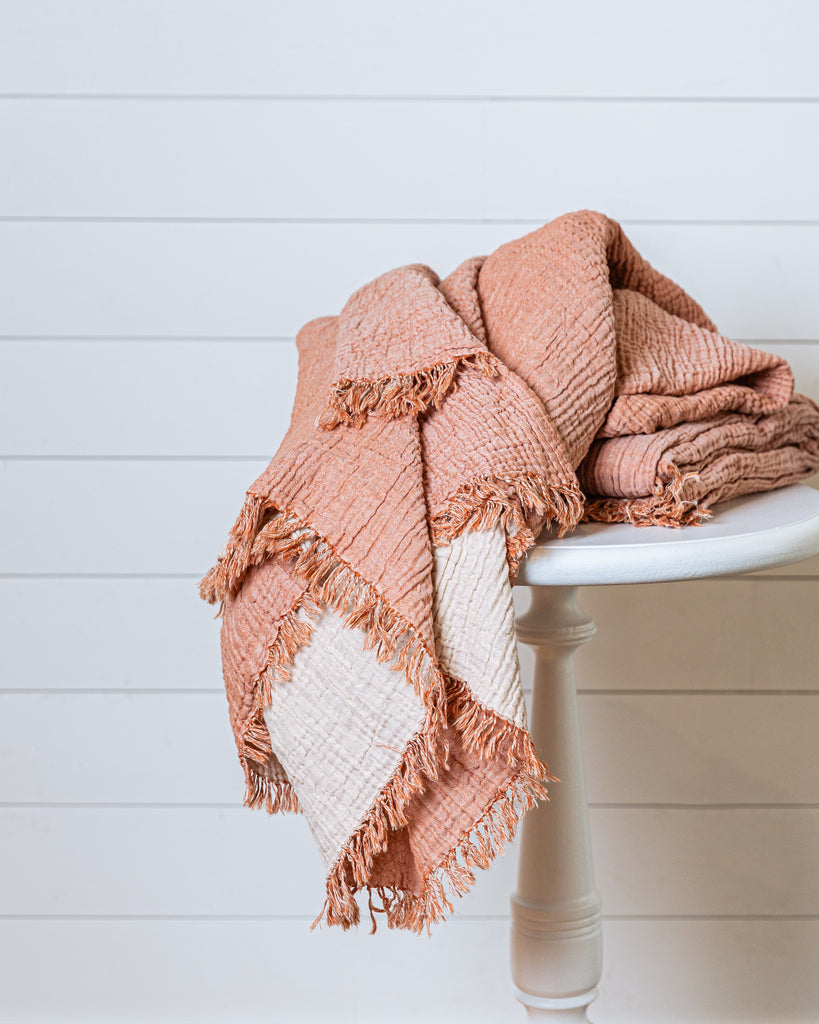 Soft terracotta and ecru muslin throw blanket in Turkish cotton with airy, crinkled weave and fringes