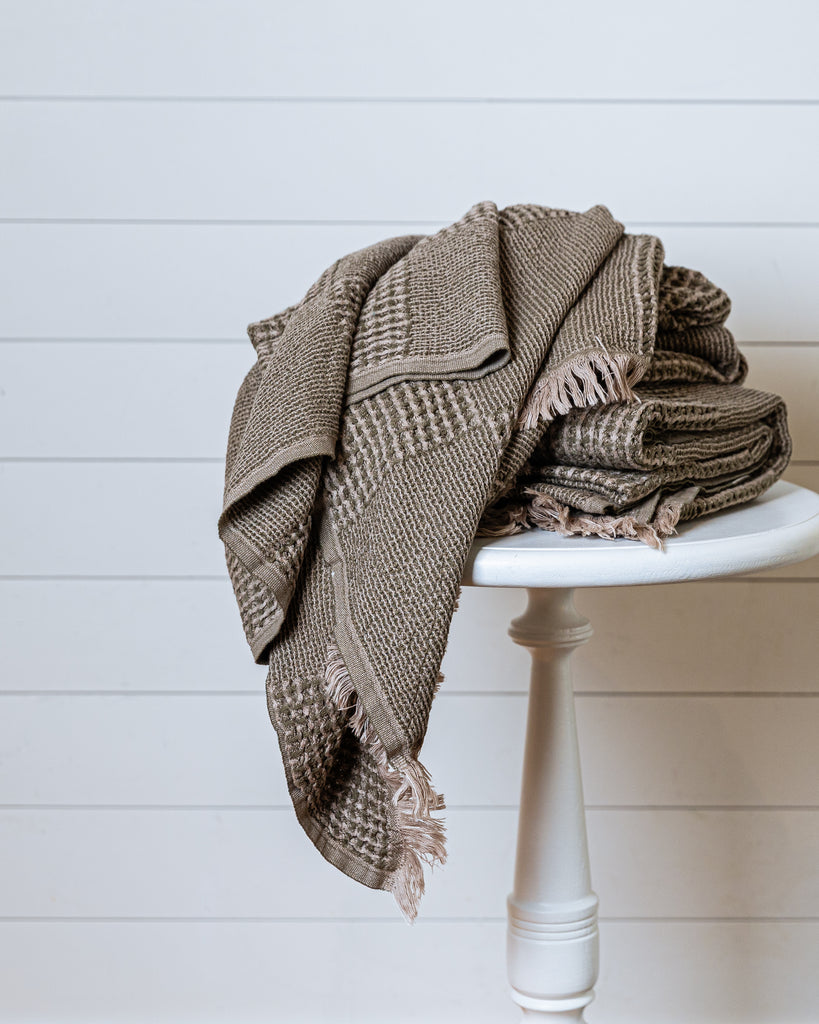 Turkish waffle-knit cotton throw in khaki and beige with fringed edges