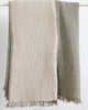 Reversible olive and ecru muslin cotton throw with soft crinkled texture and fringed edges